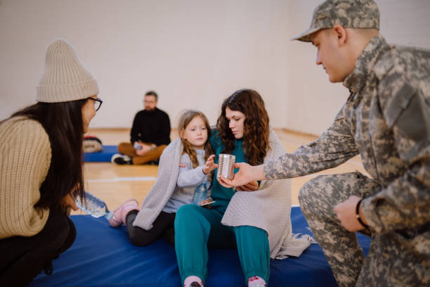 giving donations to refugees in a sheltering