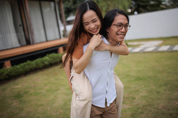 istock Happy couple having fun playing piggyback. 1894251243