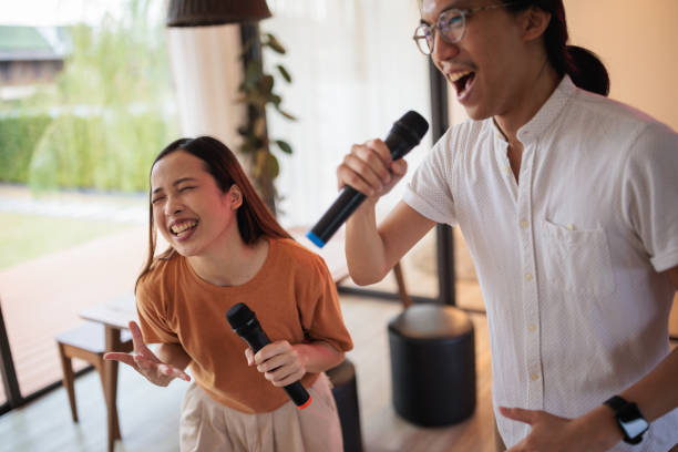 istock A couple's living room karaoke session 1894253805