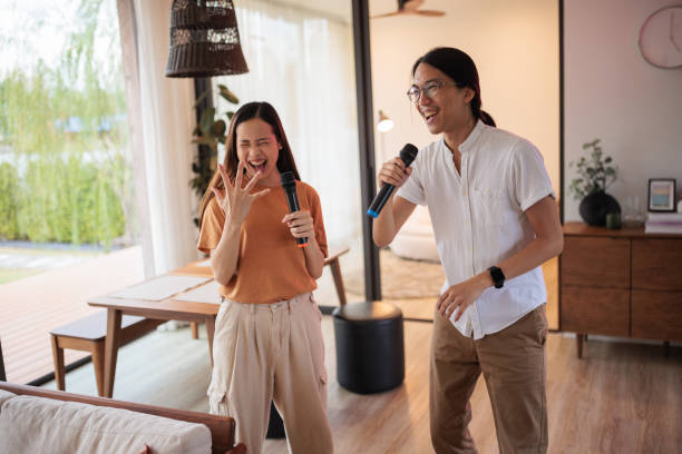 istock A couple's living room karaoke session 1894253807