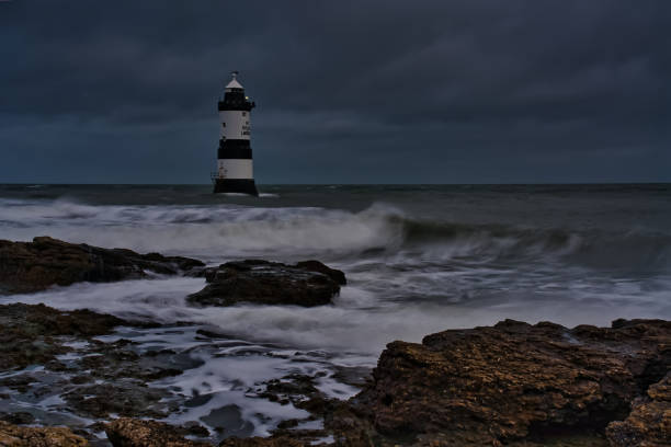 istock Penmon Point lighthouse during stormy weather, Anglesey, Wales, Britain 1894291819