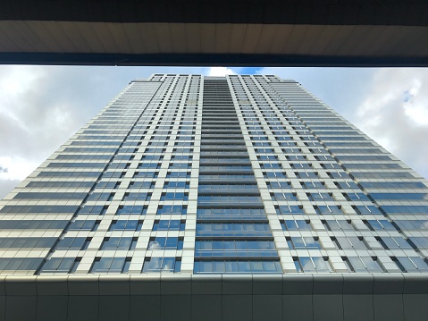High rise building against blue sky