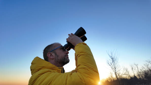 istock Amateur astronomer observing skies with binoculars. 1894311962