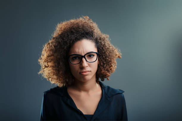 istock Furrowed brow, curls imply skepticism, intellectual vigor 1894352880