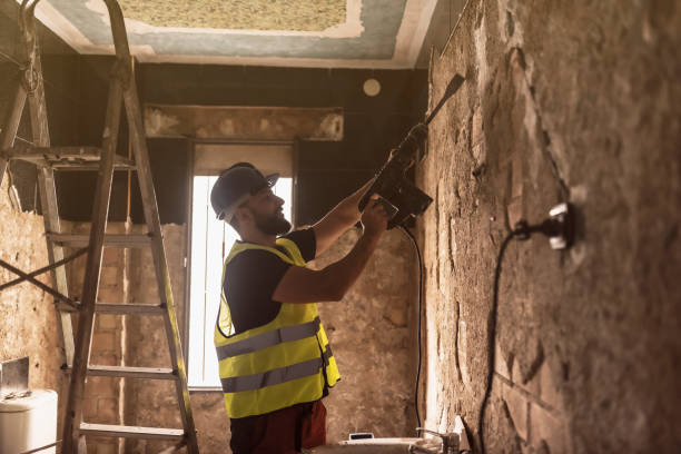 istock construction worker removes tiles with pneumatic hammer in a bathroom 1894391616