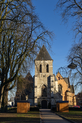 View of St.Martins church Berlare, Belgium on a sunny winter afternoon. Berlare is a municipality in East Flanders. Copy space above.