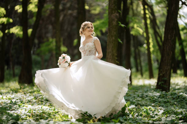 istock young girl bride in a white dress in a spring forest 1894405683