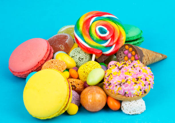 istock Colorful lollipops and different colored round candy. Top view. 1894426518