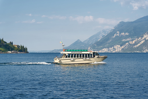 Malcesine, Italy – July 29, 2023: Ferry service between the towns of Malcesine and Limone Sul Garda on Lake Garda in Italy