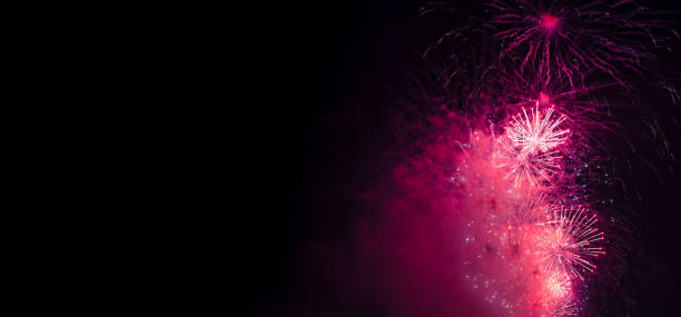 istock Holiday fireworks backgrounds with sparks, colored and bright light on black night sky, pyrotechnics. Amazing colorful fireworks at celebration, show. Holidays background concept. Copy ad text space 1894477459