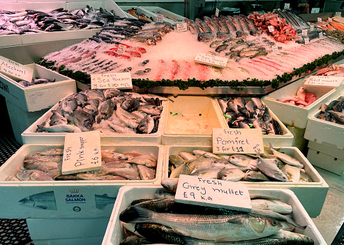 Fish for sale at a fishmonger's in Walthamstow High Street, London. December 2023