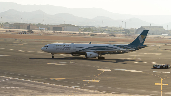 Muscat, oman- November 21,2023: oman air airplane getting ready to take off from muscat international airport