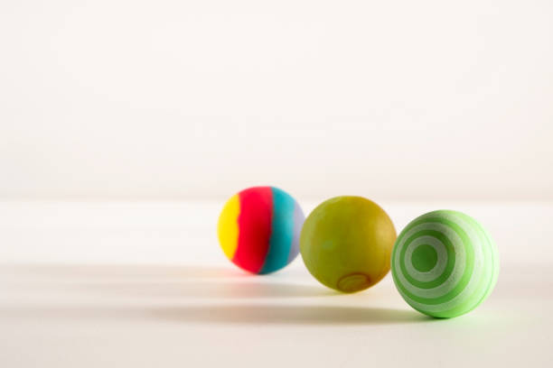 istock Rubber ball of various colors on a keyboard. 1894616286