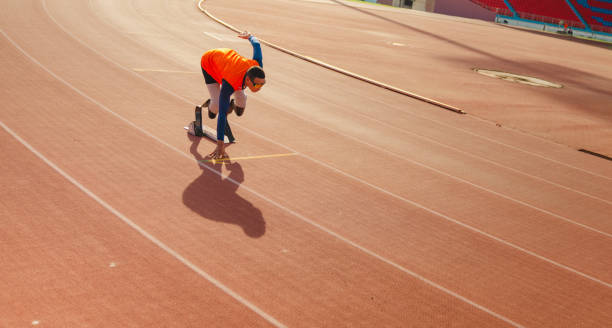 istock Asian para-athlete runner prosthetic leg 1894674692