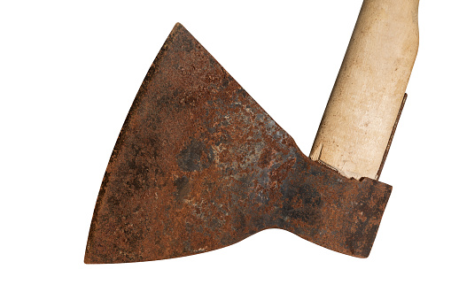 Rusty big ax on an isolated white background. Old tool for chopping meat. Metal corrosion. Closeup.