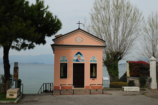 Picturesque Chapel On The Shore Of Lake Garda In Desenzano Italy On A Wonderful Spring Day With A Few Clouds In The Sky