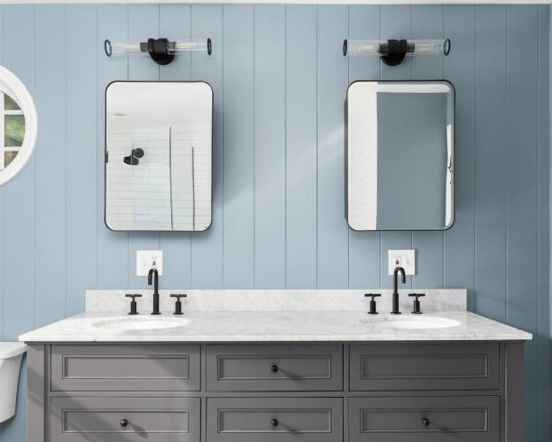 istock A bathroom with a blue panel wall and white marble countertop. 1894691668