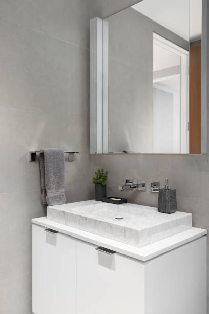 istock A bathroom detail with a white marble vessel sink. 1894691669