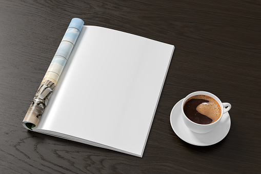 Magazine right-hand page mockup and cup of coffee on black wooden desk. 3d illustration
