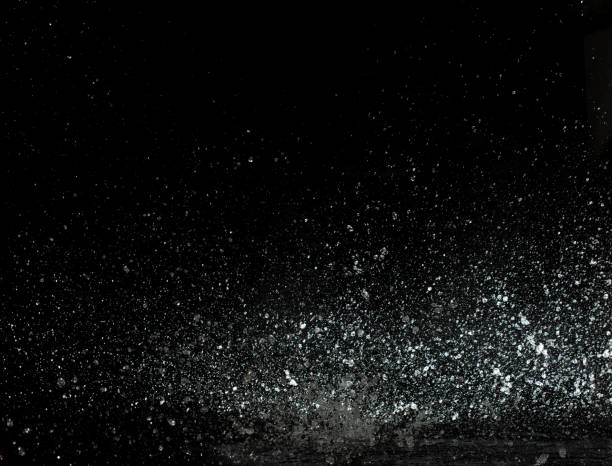 istock Throwing of Water splashes into drop water attack fluttering in wall floor and stop motion freeze shot. Splash Water for explosion texture graphic resource elements, black background isolated 1894725793