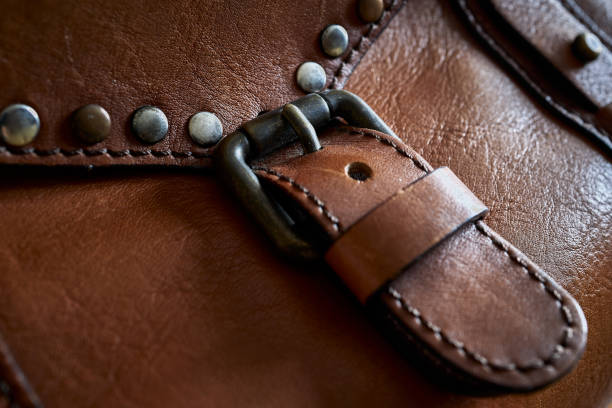 istock Metal buckle on a brown leather bag. 1894748809