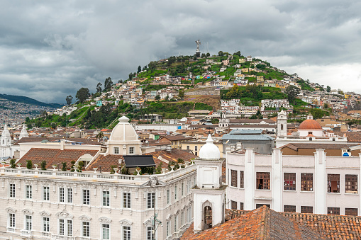 Aerial Quito historic city center with dramatic clouds, Ecuador.