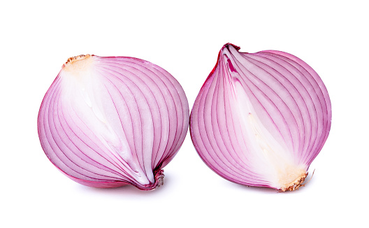 Top view of two halves or onion slices is isolated on white background with clipping path.