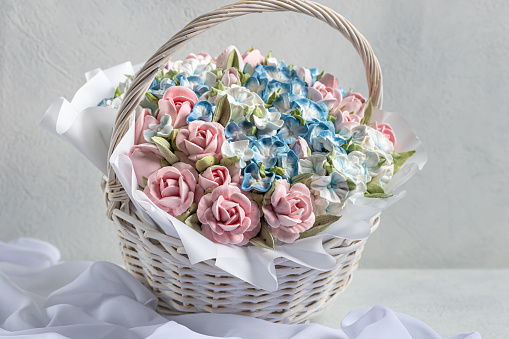 Zephyr bouquet of flowers in a gift box on a light background. Zephyr with a minimum amount of sugar. a natural product