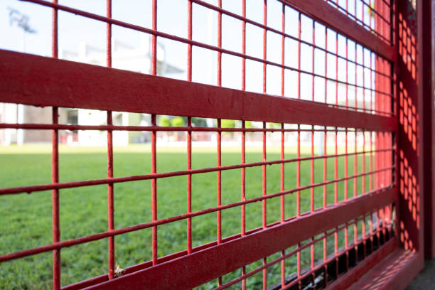Close ups outside the iron mesh of the stadium