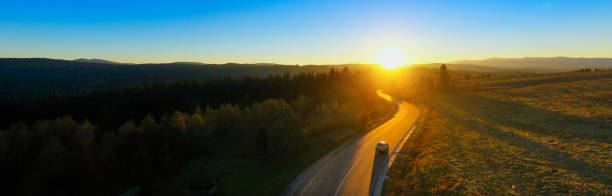 istock Journey Through Fall: Mountain Road to Sunset Bliss 1894792366