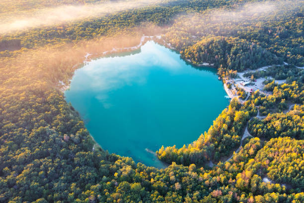 istock Nature's Gem from Above: A Tranquil Forest Lake Painted with Summer's Blissful Blue 1894798219