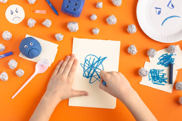 istock Studying and drawing emotions with kids, ecological ways of anger expression 1894891470