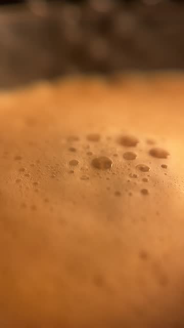 Close-up of very creamy coffee being served