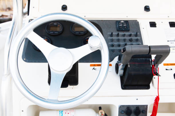 istock Motor yacht control panel. Steering wheel and gear levers. 1894926186