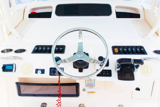 istock Internal control cabin of a motor yacht. Control panel, steering wheel and gear levers. 1894926194