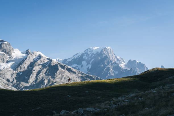 istock Trail runner bounds along mountain trail 1894936371