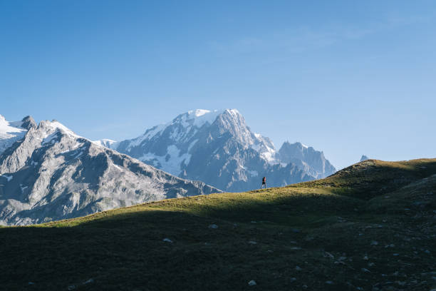 istock Trail runner bounds along mountain trail 1894936696