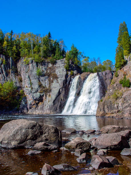 istock Minnesota North Shore Waterfall with Clear Blue Sky in October 1894976752