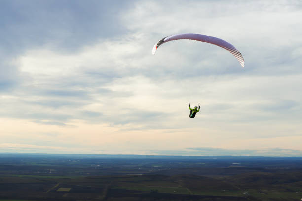 istock Paraglider silhouette with landscape 1894996640