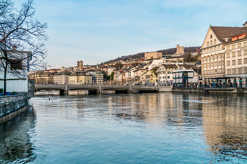Zurich, Switzerland, June 17, 2023 View over the Limmat river with the towers of the Munster church in the background