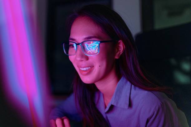 istock Portrait of a woman with eyeglasses working on a computer 1895046854