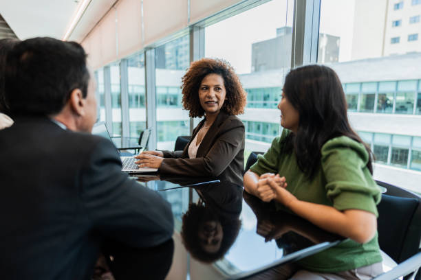 Coworkers talking on business meeting at office