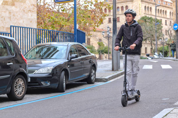 istock Young white guy riding an electric scooter 1895077784