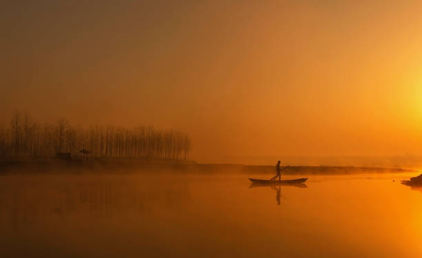 istock Fisherman and The Sun 1895084513