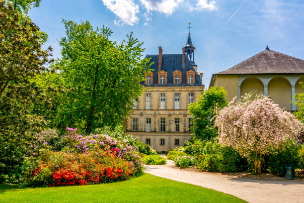 Fontainebleau palace (Chateau de Fontainebleau) and gardens in spring, France Paris, France - May 2019: Fontainebleau palace and park outside Paris in spring chateau de fontainbleau stock pictures, royalty-free photos & images