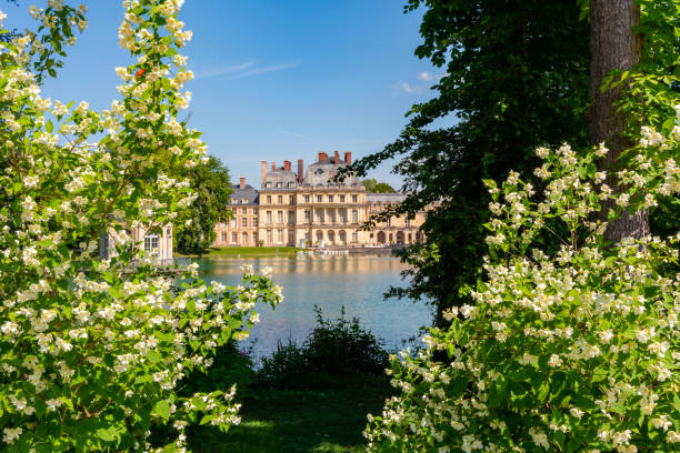 Fontainebleau palace and park outside Paris in spring, France Paris, France - May 2019: Fontainebleau palace and park outside Paris in spring chateau de fontainbleau stock pictures, royalty-free photos & images