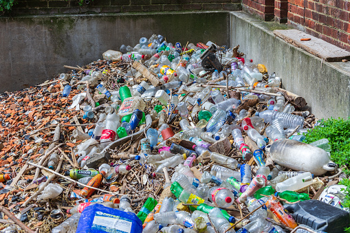 Queenhithe, London, UK -  August 19th 2014: Piles of trash washed up from the River Thames on Queenhithe Dock.