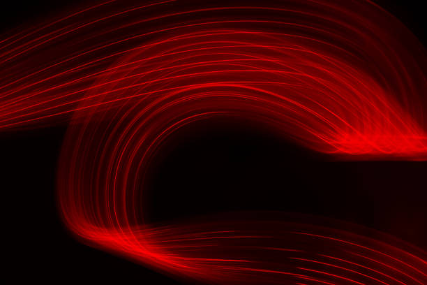 istock Fiber optic light effect in red color on dark background. 1895251065