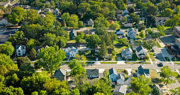 Aerial view of residential homes in Grand Haven, a small city in Ottawa County, Michigan, on a clear day in Fall.