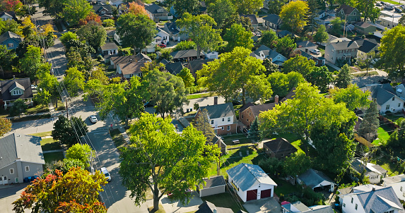 Aerial view of residential homes in Grand Haven, a small city in Ottawa County, Michigan, on a clear day in Fall.